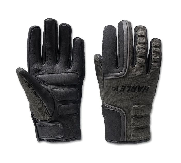 A pair of women's waterproof motorcycle gloves in black, with contrast knitting and a velcro wrist closure.