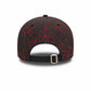 Black and red cap with abstract pattern on a white background